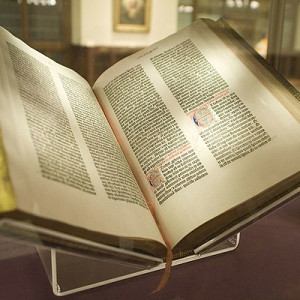 Open book with gold-leaf edges on display.