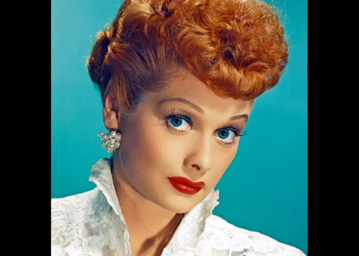 Lucille Ball with red hair and blue eyes.