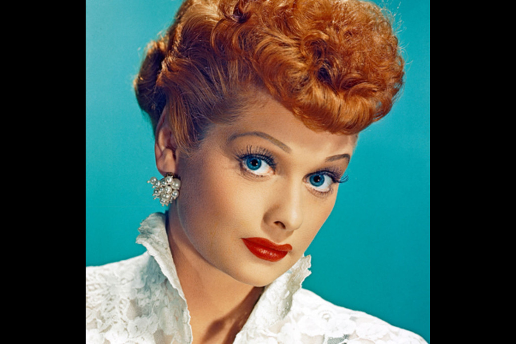 Lucille Ball with red hair and blue eyes.