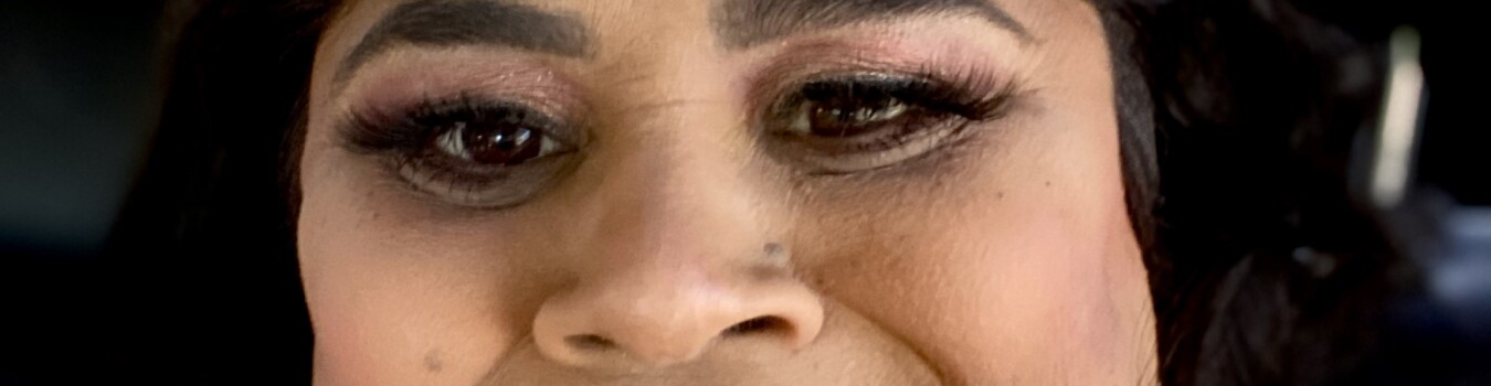 Close-up of a woman's eye and nose.